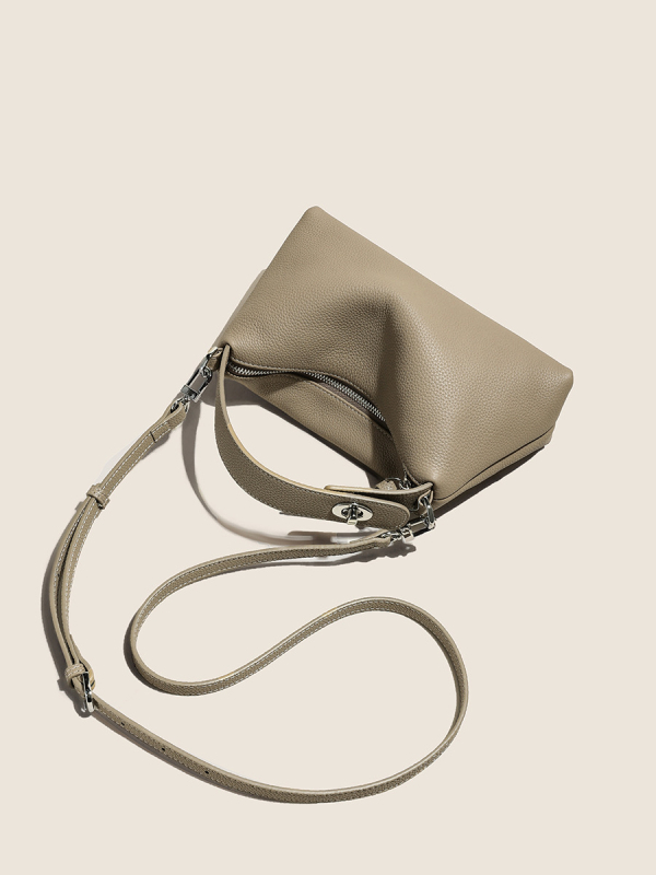 Első réteg marhabőrből készült tote táska, városi minimalistikus stílus, párnás alak, cipzáros zárás, belső zsebek telefon és ID számára