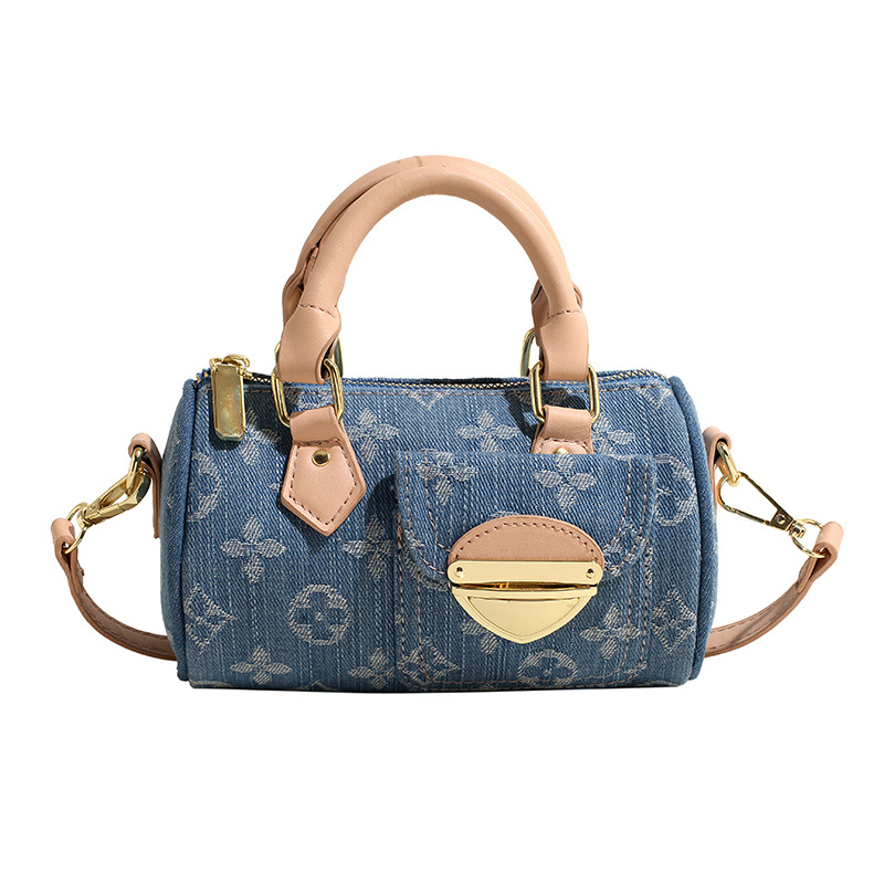 Denim cilindrična crossbody torba s poklopcem, zip zatvaračem i unutarnjim pretincom za telefon