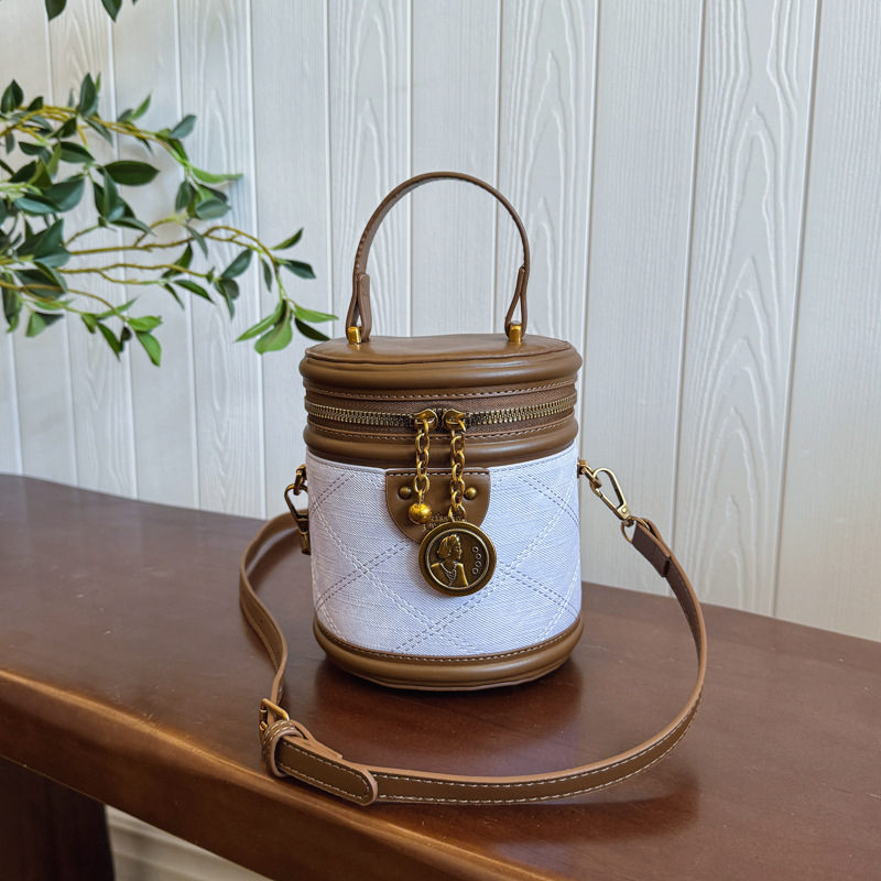 Jonica Ženska bucket torba: gradski minimalistički stil, PU materijal, cilindrični oblik, otvaranje preklopnim poklopcem