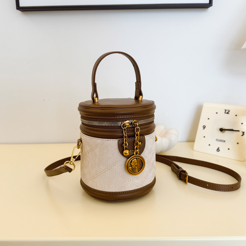 Jonica Ženska bucket torba: gradski minimalistički stil, PU materijal, cilindrični oblik, otvaranje preklopnim poklopcem
