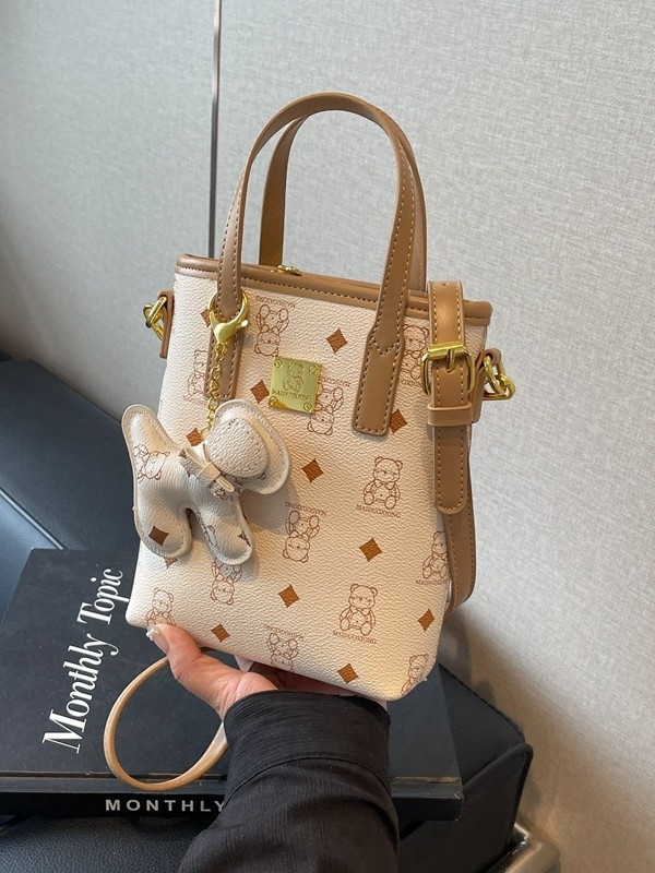 Ženska bucket torba od PU-a, 2025 novi model, kompaktnog vertikalnog kvadratnog oblika, crossbody torba s pretincem za telefon, gradski minimalistički stil.