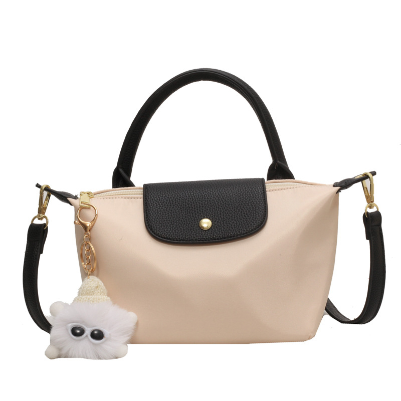 Crossbody torba od tkanine, vodoravnog kvadratnog oblika, zatvaranje kapom, unutarnji džep sa zipom, s jednim remenom