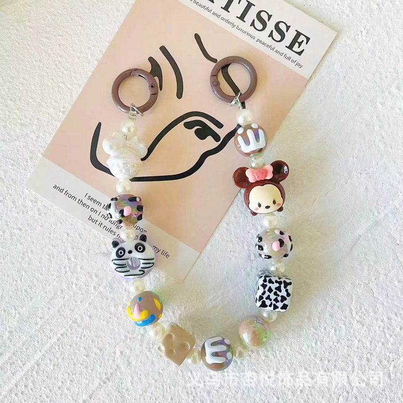 Ručni izrađeni lanac za telefon od perlica s originalnim dizajnom; privjesak animiranog lika Kitty/Snoopy; materijal: plast/smola; marka Xingyue
