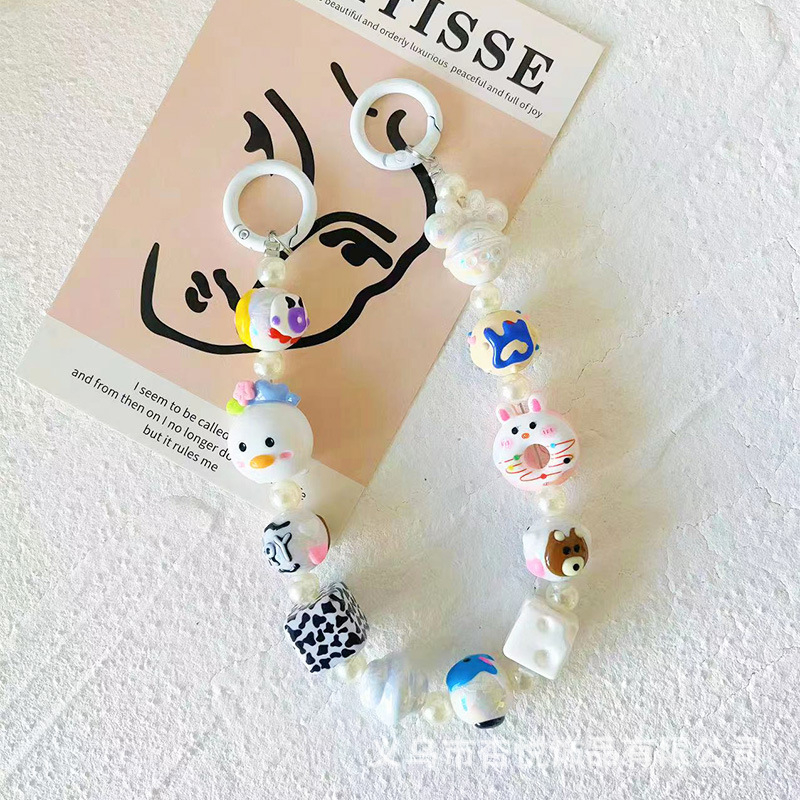 Ručni izrađeni lanac za telefon od perlica s originalnim dizajnom; privjesak animiranog lika Kitty/Snoopy; materijal: plast/smola; marka Xingyue
