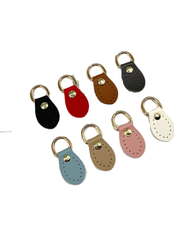 Odiniai maišo priedai – rankų siuvimas, šoninė sagtis ir kabinamas ausis, pora