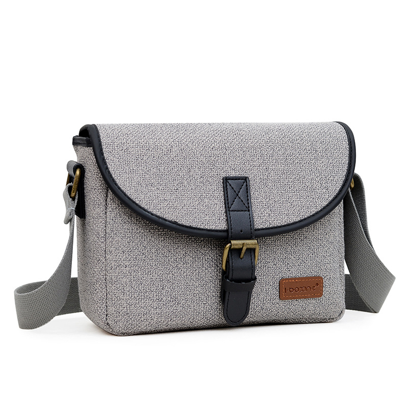 Nylon vállkamera táska DSLR/Mirrorlesshez, Modell D32, 1 kamera + 2 objektív befogadás, vízlepergető, kopásálló, lopás elleni védelem, ütésálló