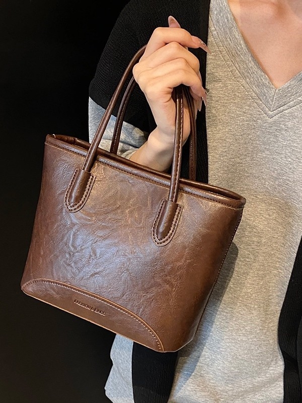 Bucket torba od PU materijala, cilindrični oblik, zatvarač, unutarnja podstava od najlona, gradski minimalistički stil