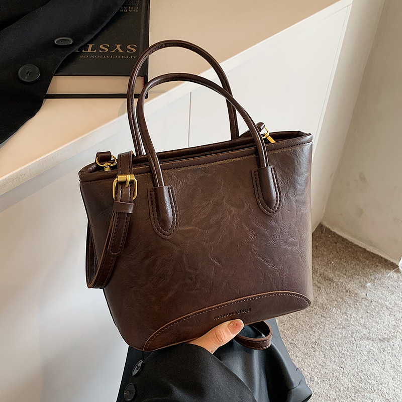 Bucket torba od PU materijala, cilindrični oblik, zatvarač, unutarnja podstava od najlona, gradski minimalistički stil