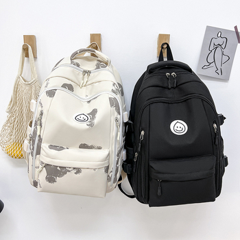 Unisex nailono kuprinė universitetui — ergonominis nugaros skydas, išplėtus talpą, miesto minimalistinis stilius, šypsenėlės spaudas