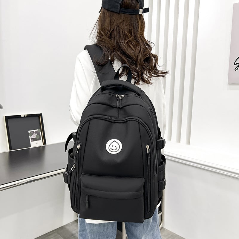 Unisex nailono kuprinė universitetui — ergonominis nugaros skydas, išplėtus talpą, miesto minimalistinis stilius, šypsenėlės spaudas