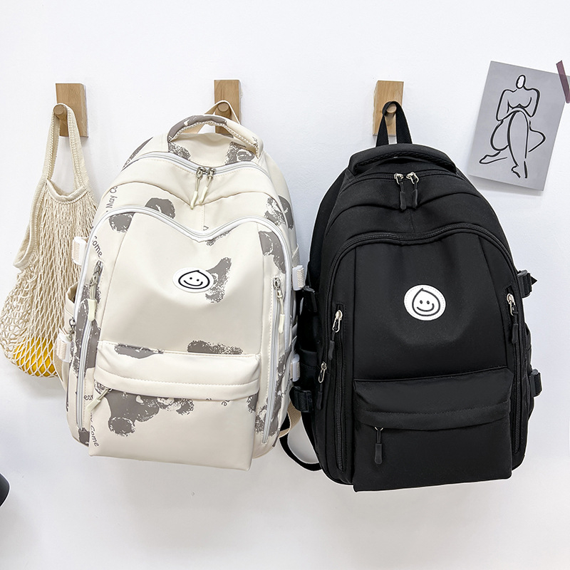 Unisex nailono kuprinė universitetui — ergonominis nugaros skydas, išplėtus talpą, miesto minimalistinis stilius, šypsenėlės spaudas