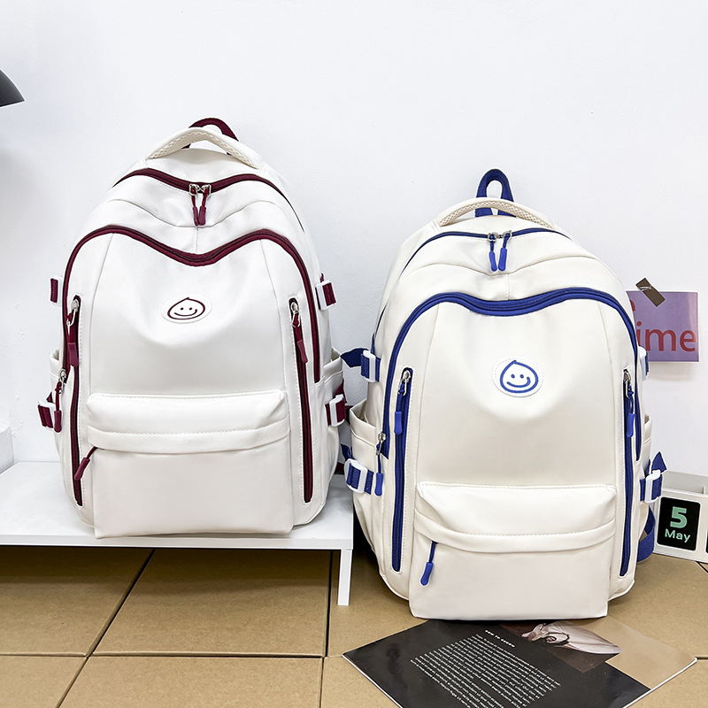 Unisex nailono kuprinė universitetui — ergonominis nugaros skydas, išplėtus talpą, miesto minimalistinis stilius, šypsenėlės spaudas