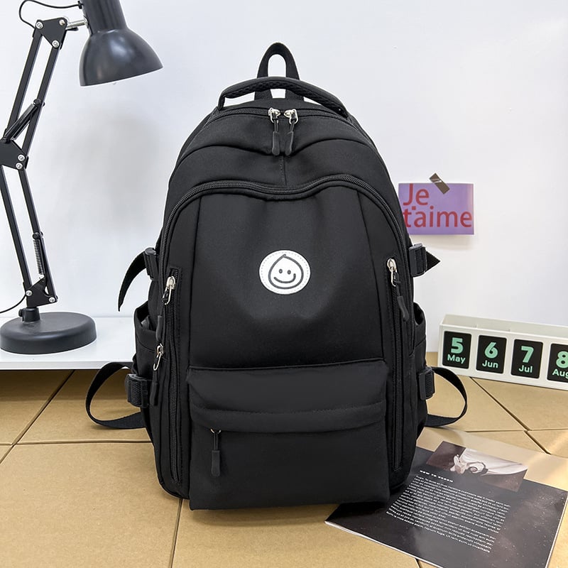 Unisex nailono kuprinė universitetui — ergonominis nugaros skydas, išplėtus talpą, miesto minimalistinis stilius, šypsenėlės spaudas