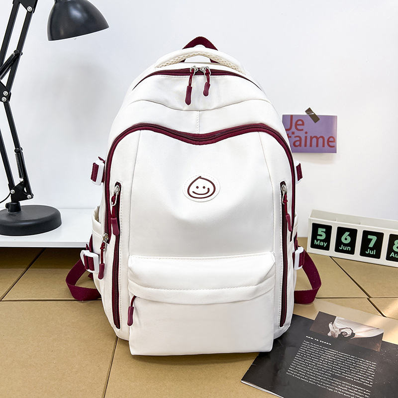 Unisex nailono kuprinė universitetui — ergonominis nugaros skydas, išplėtus talpą, miesto minimalistinis stilius, šypsenėlės spaudas