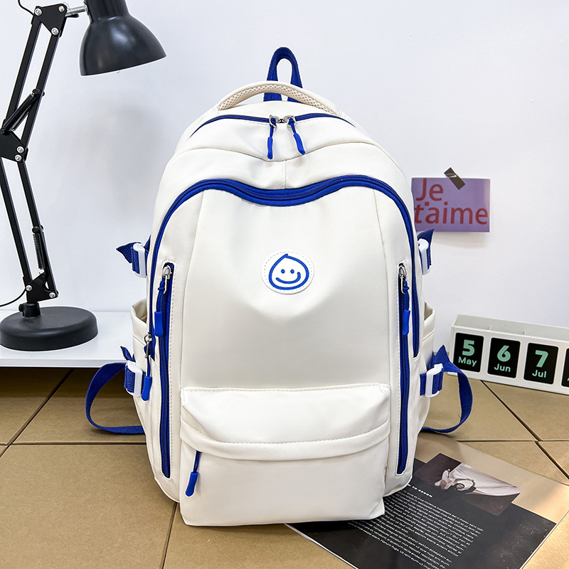 Unisex nailono kuprinė universitetui — ergonominis nugaros skydas, išplėtus talpą, miesto minimalistinis stilius, šypsenėlės spaudas