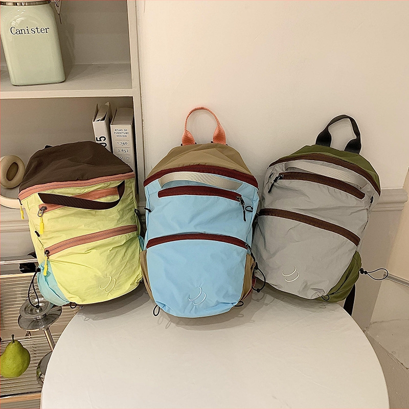 Unisex neilona mugursoma – elpojoša, ārkārtīgi viegla, paplašināms tilpums, gaisa spilvena siksnas, poliestera odere, piemērota vidusskolai