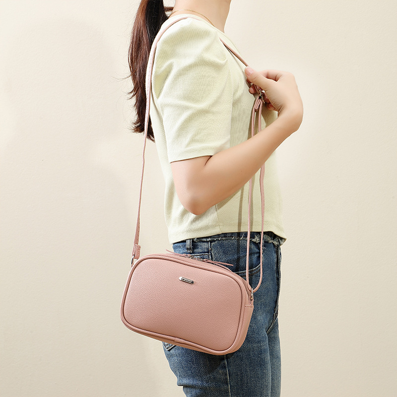 Ženska crossbody torba, PVC, kružnog oblika, zatvarač, najlon podstava, džep za mobitel