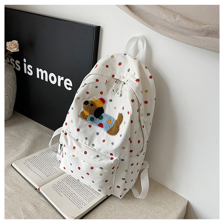 Mergaitėms skirta kuprinė su šuniuko taškų motyvu; didelė talpa, lengva, kvėpuojanti konstrukcija, nailonas, poliesterio pamušalas, laisvalaikio kelionės stilius