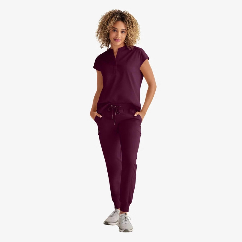 Set unisex de îmbrăcăminte medicală: mâneci scurte, decolteu în V, țesătură cu uscare rapidă, elasticitate în patru direcții.