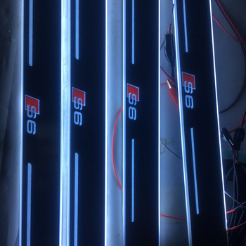 4 gab. bezvadu infrred indukcijas komplekts Audi A6 RS6 ar LED durvju sliekšņiem un sagaidīšanas pedāļiem