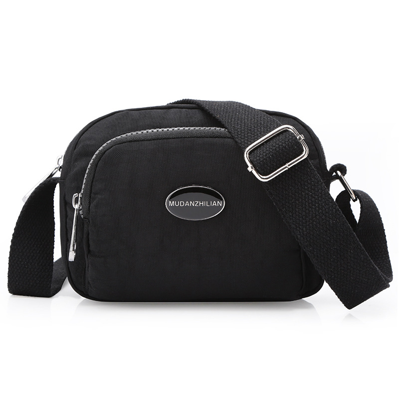 MDZL crossbody kvadratna torbica od najlona, zatvaranje na zip, unutrašnji džepovi: skriveni džep sa zipom, džep za telefon, džep za ID, džep za kameru