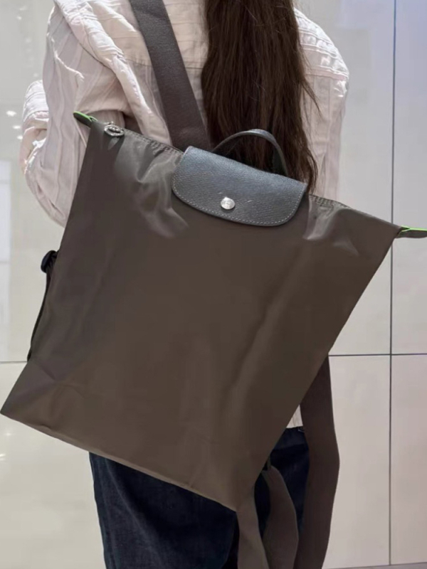 Ghiozdan pliabil, impermeabil din nailon, capacitate 20–35 L, compatibil cu laptop de 14 inch