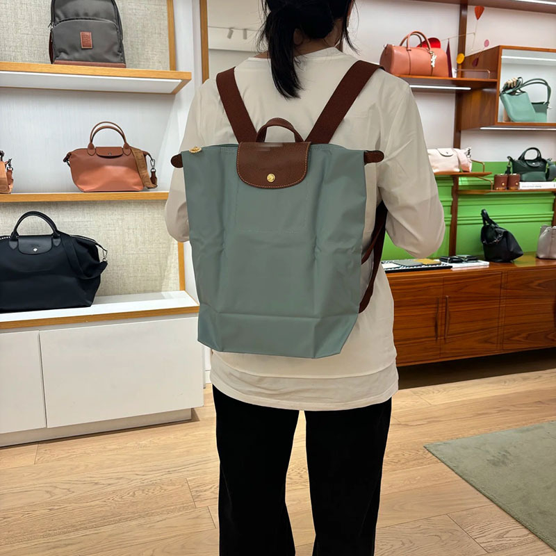 Ghiozdan pliabil, impermeabil din nailon, capacitate 20–35 L, compatibil cu laptop de 14 inch