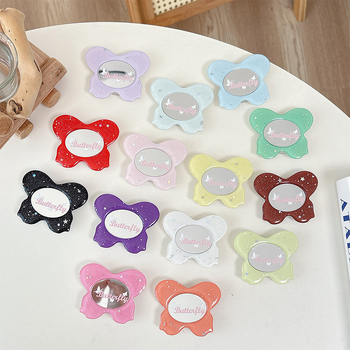 Asztali telefon-tartó csillogó pillangó díszítéssel, kis tükrövel, teleszkópos kar, ragasztóval rögzíthető, műanyag, univerzális kialakítás