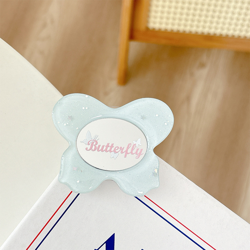 Asztali telefon-tartó csillogó pillangó díszítéssel, kis tükrövel, teleszkópos kar, ragasztóval rögzíthető, műanyag, univerzális kialakítás