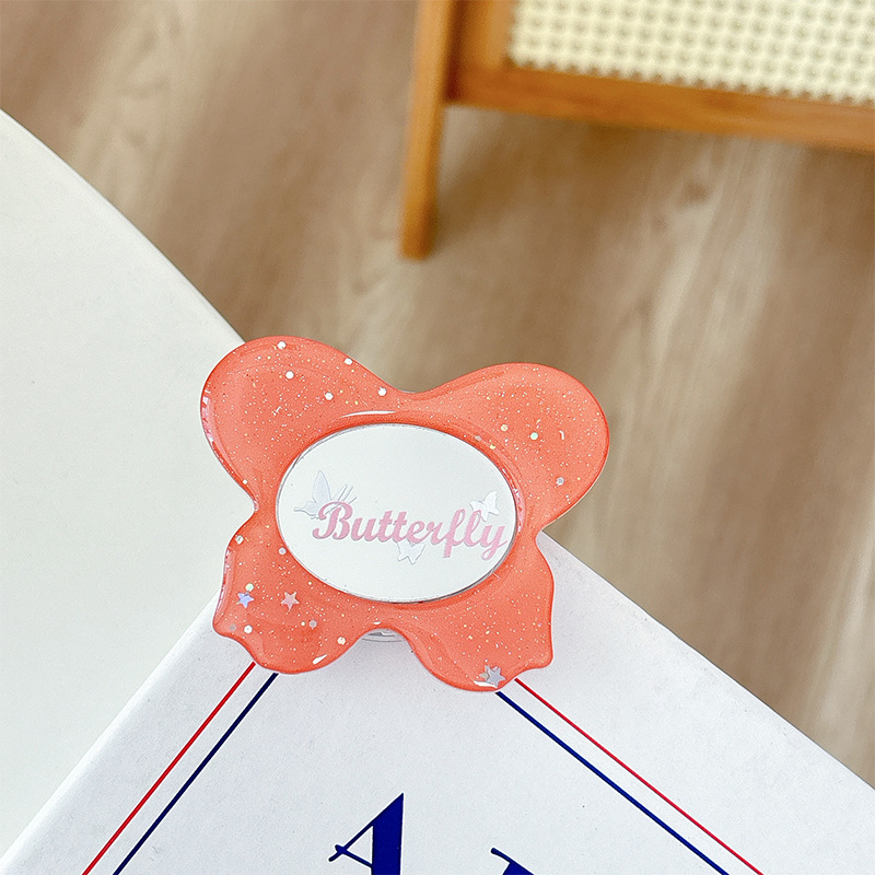 Asztali telefon-tartó csillogó pillangó díszítéssel, kis tükrövel, teleszkópos kar, ragasztóval rögzíthető, műanyag, univerzális kialakítás