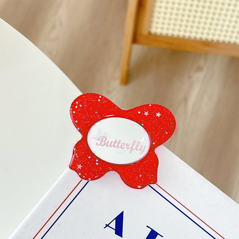 Asztali telefon-tartó csillogó pillangó díszítéssel, kis tükrövel, teleszkópos kar, ragasztóval rögzíthető, műanyag, univerzális kialakítás