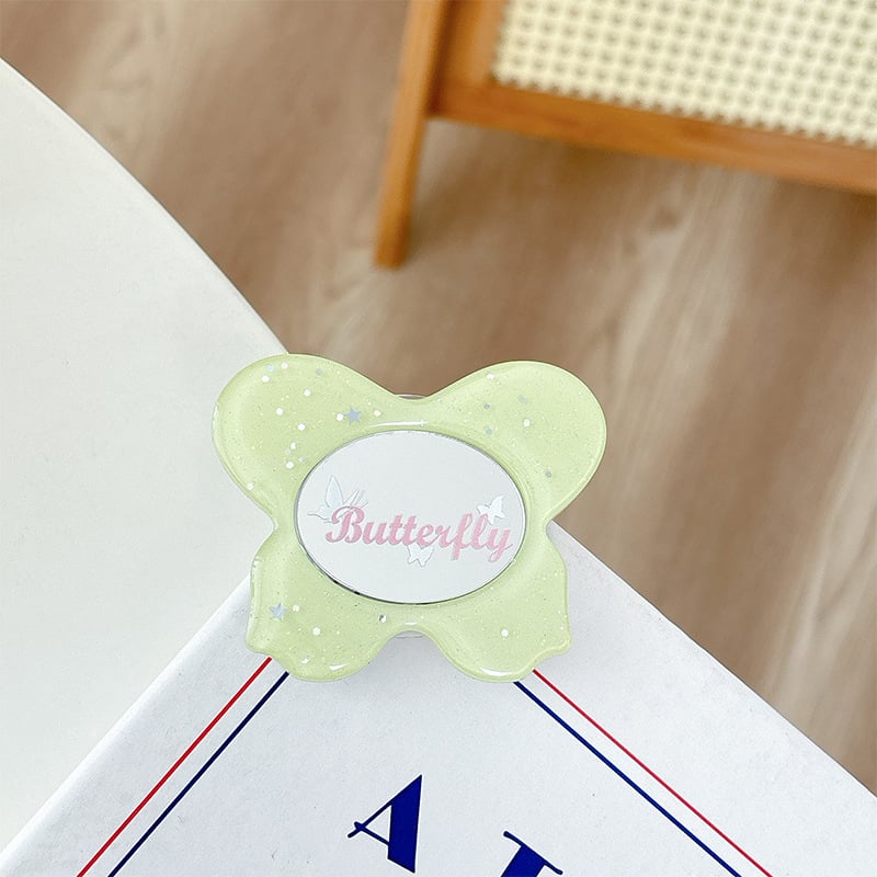 Asztali telefon-tartó csillogó pillangó díszítéssel, kis tükrövel, teleszkópos kar, ragasztóval rögzíthető, műanyag, univerzális kialakítás