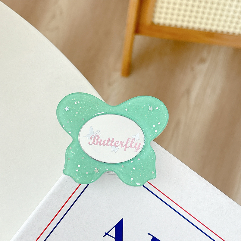 Asztali telefon-tartó csillogó pillangó díszítéssel, kis tükrövel, teleszkópos kar, ragasztóval rögzíthető, műanyag, univerzális kialakítás