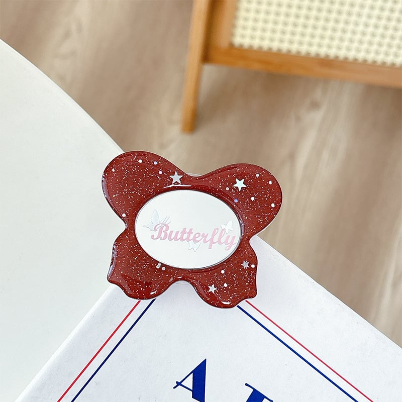 Asztali telefon-tartó csillogó pillangó díszítéssel, kis tükrövel, teleszkópos kar, ragasztóval rögzíthető, műanyag, univerzális kialakítás