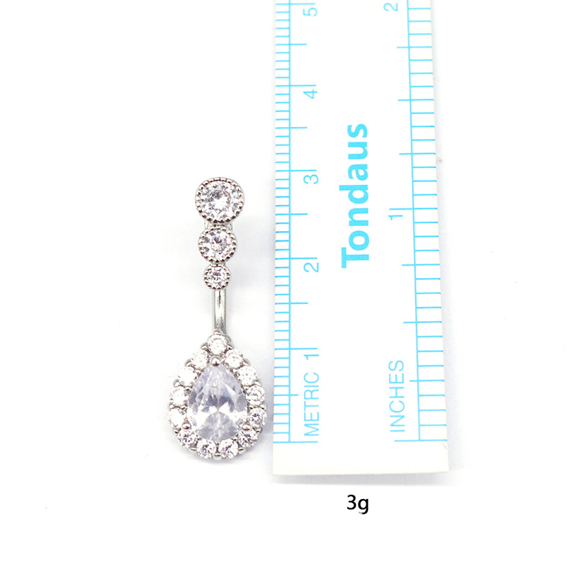 Piercing pupka - prsten pupka u obliku kapljice vode, tri cirkon kamenčića, kapljasti dizajn, unisex, crtani stil, mesing + bijela čelična