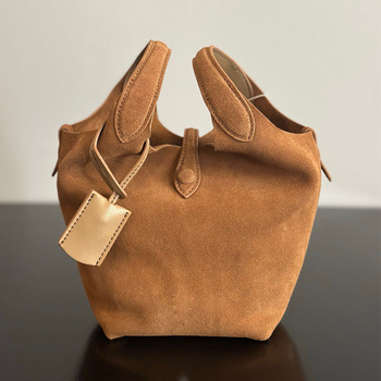 Õiges nahast bucket-kott, esimesest kihist veise nahk, vooder nahk, köisvoldiga sulgemine, sisemine mobiiltelefoni tasku