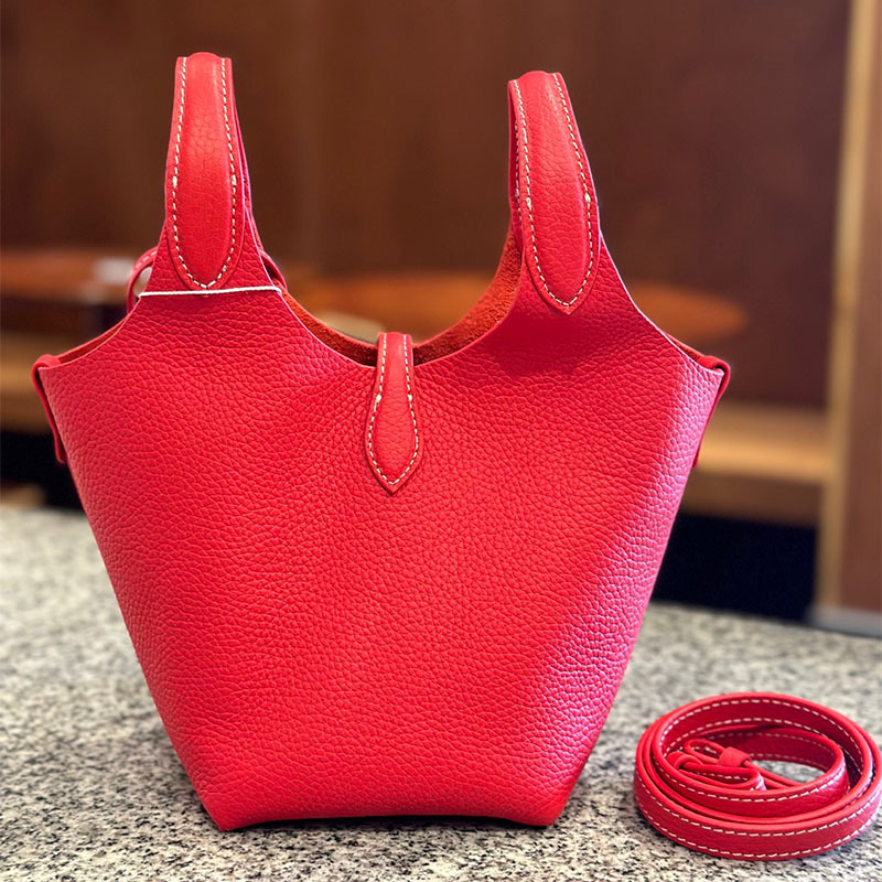 Õiges nahast bucket-kott, esimesest kihist veise nahk, vooder nahk, köisvoldiga sulgemine, sisemine mobiiltelefoni tasku