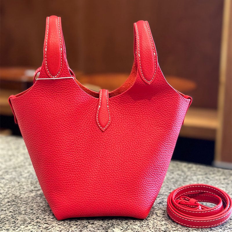 Õiges nahast bucket-kott, esimesest kihist veise nahk, vooder nahk, köisvoldiga sulgemine, sisemine mobiiltelefoni tasku