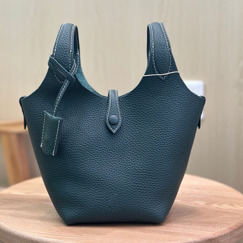 Õiges nahast bucket-kott, esimesest kihist veise nahk, vooder nahk, köisvoldiga sulgemine, sisemine mobiiltelefoni tasku