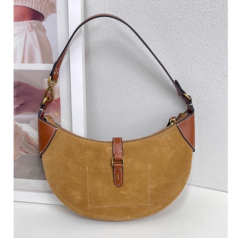 Geantă tote din piele naturală, formă rotundă, închidere cu lacăt, căptușeală din poliester, numeroase buzunare interioare