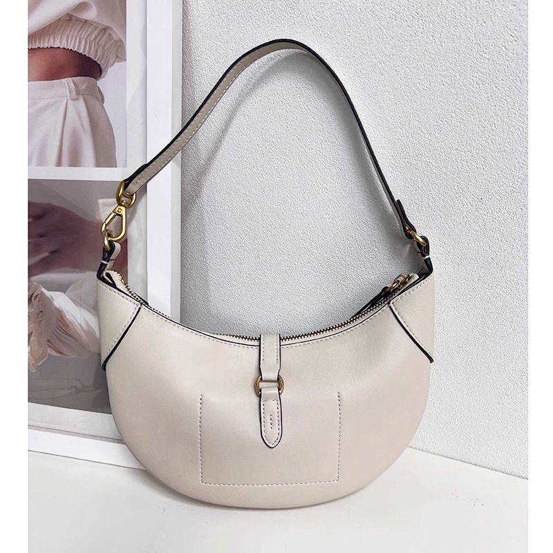 Geantă tote din piele naturală, formă rotundă, închidere cu lacăt, căptușeală din poliester, numeroase buzunare interioare