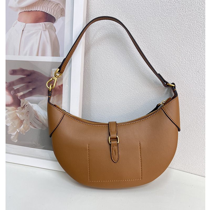 Geantă tote din piele naturală, formă rotundă, închidere cu lacăt, căptușeală din poliester, numeroase buzunare interioare