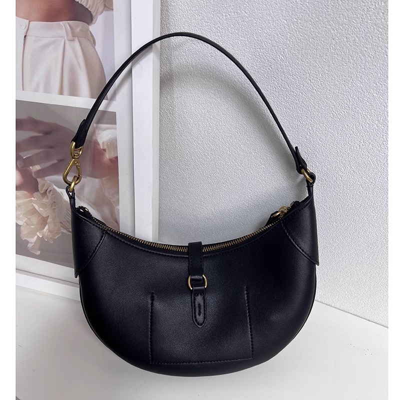 Geantă tote din piele naturală, formă rotundă, închidere cu lacăt, căptușeală din poliester, numeroase buzunare interioare