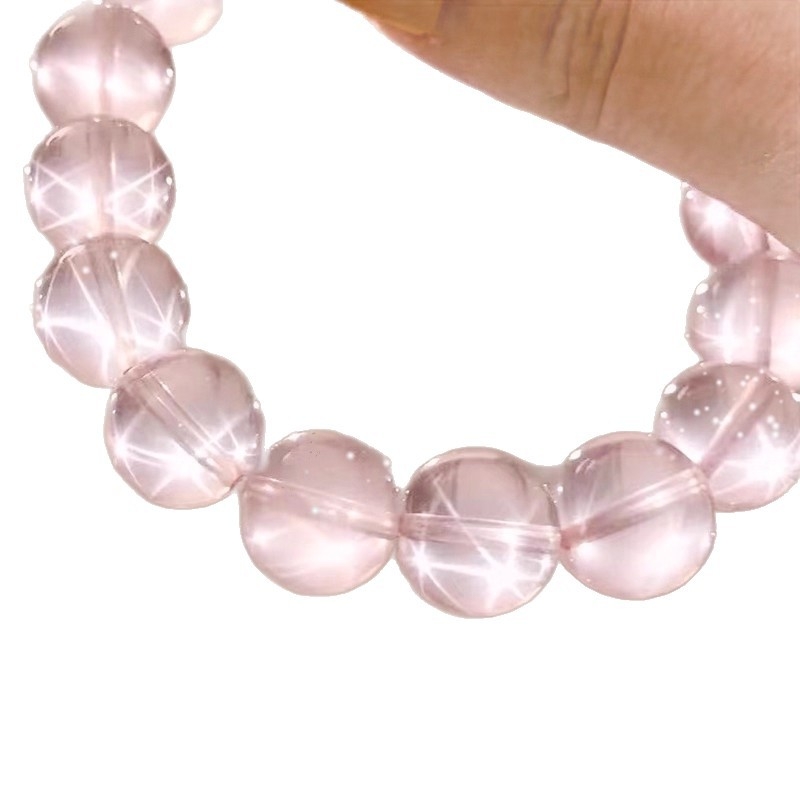 Kristalni narukvica — ključne značajke: Materijal: kristal; Vrsta kristala: ružičasti kvarc; Oblik: geometrijski; Tehnika obrade: brušenje i poliranje; Stil: svježi i slatki