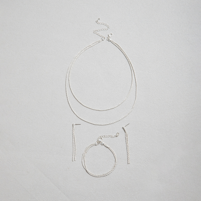 Réz ékszerkészlet: nyaklánc, fülbevaló és karkötő, víz-hullámú lánccal és rhinestone medállal