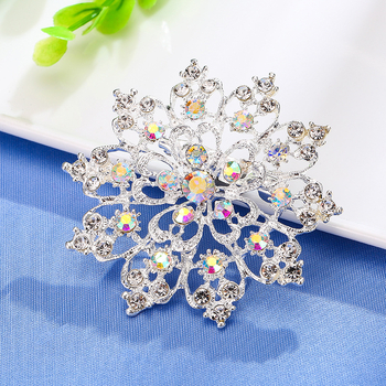 Ötvözetből készült rhinestone napraforgó kitűző koronás motívummal, uniszex