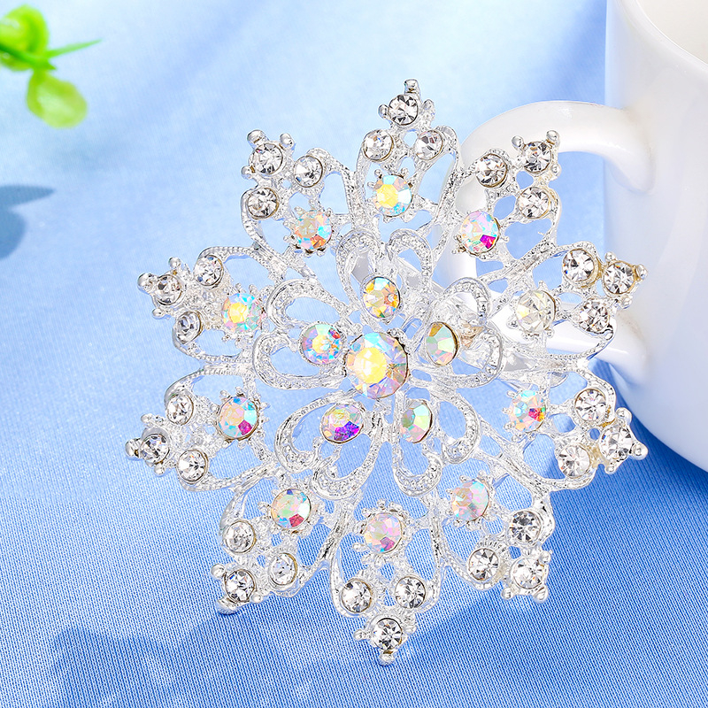 Ötvözetből készült rhinestone napraforgó kitűző koronás motívummal, uniszex