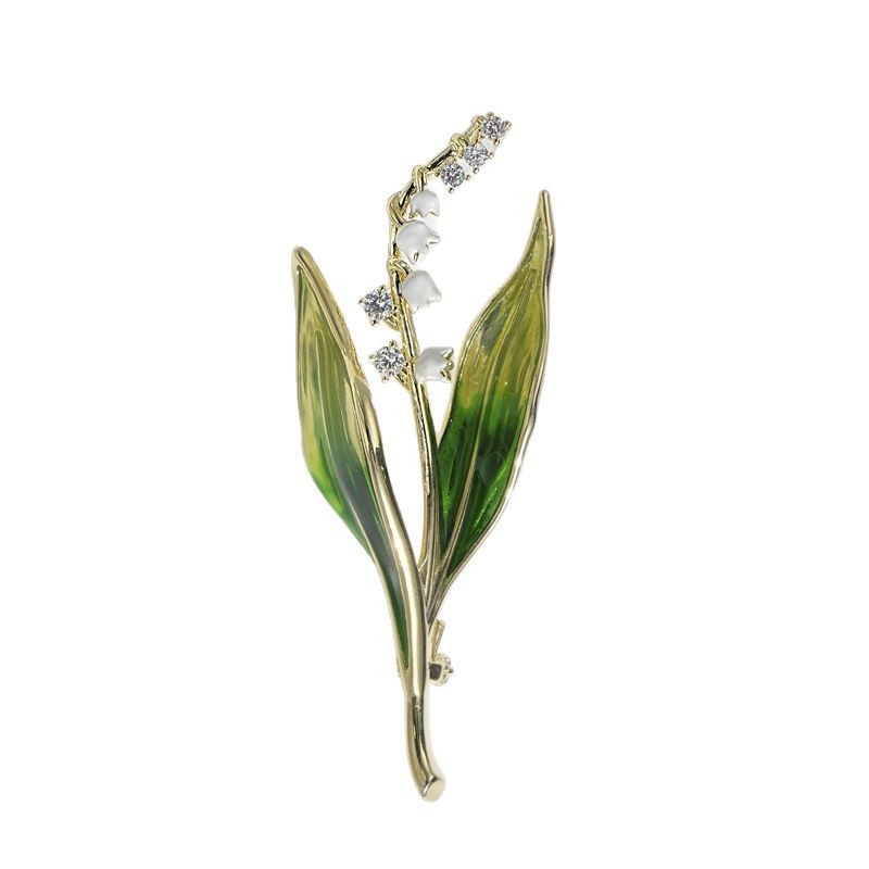 Broșă cu motiv floare liliuța văii, bază de cupru, pietre zirconiu, placare electrolitică