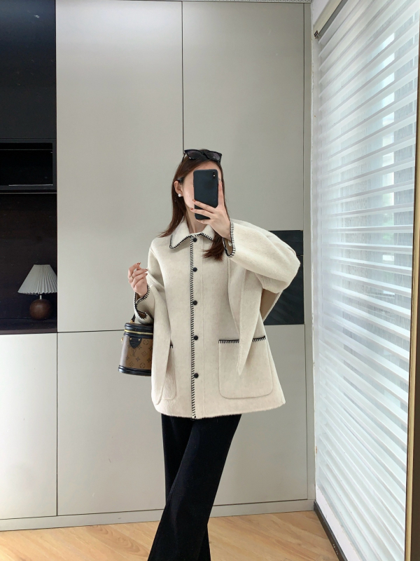 Ženski vuneni kaput s reverom, jednostruko kopčanje, dugi rukavi, debela vuna, duljina 50–65 cm