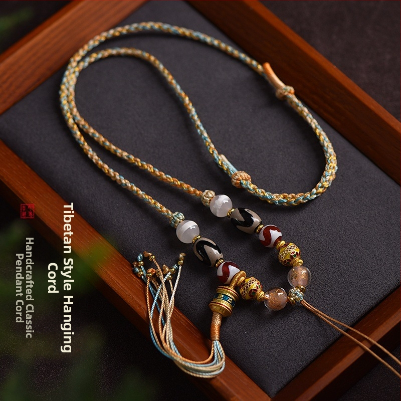 Uniszex hosszú nyaklánc tibeti etnikus stílusban, kézzel készített fonatolt zsinór Dzi gyöngyökkel, buddhista amulett és méhviasz Thangka medál